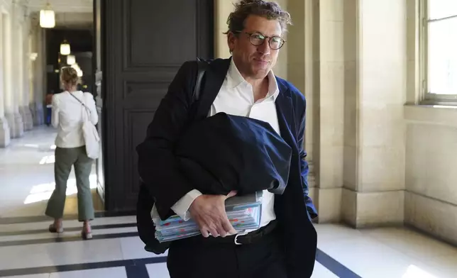 Joseph Hazan, a lawyer for Aomar Aït Khedache, one of the men accused in the 2016 armed robbery of Kim Kardashian, arrives at the palace of justice Monday, April 28, 2025 in Paris. (AP Photo/Aurelien Morissard)