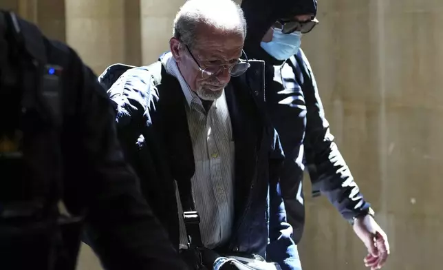 Defendant Aomar Aït Khedache, one of the men accused in the 2016 armed robbery of Kim Kardashian, arrives at the palace of justice Monday, April 28, 2025 in Paris. (AP Photo/Aurelien Morissard)
