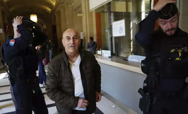 Yunice Abbas, one of the men accused in the 2016 armed robbery of Kim Kardashian, arrives at the palace of justice Monday, April 28, 2025 in Paris. (AP Photo/Aurelien Morissard)