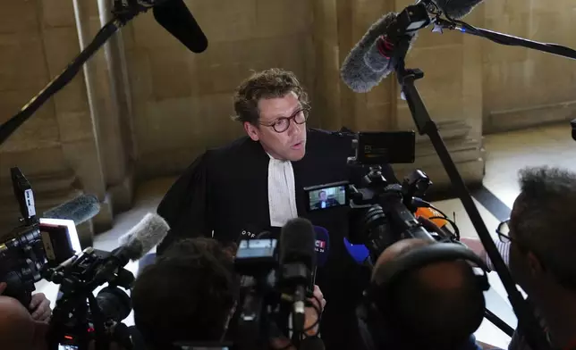 Joseph Hazan, a lawyer for Aomar Aït Khedache, one of the men accused in the 2016 armed robbery of Kim Kardashian, talks top the press at the palace of justice Monday, April 28, 2025 in Paris. (AP Photo/Aurelien Morissard)