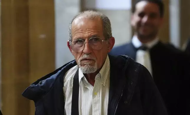 Defendant Aomar Aït Khedache, one of the men accused in the 2016 armed robbery of Kim Kardashian, leaves during a break at the palace of justice Monday, April 28, 2025 in Paris. (AP Photo/Aurelien Morissard)