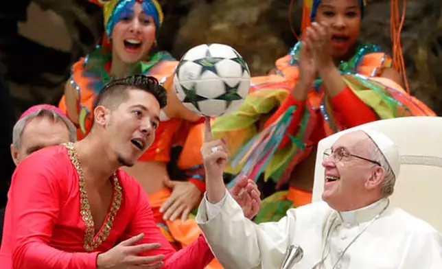 FILE - Pope Francis twirls a soccer ball he was presented by a member of the Circus of Cuba, during his weekly general audience in the Pope Paul VI hall, at the Vatican, Wednesday, Jan. 2, 2019. (AP Photo/Andrew Medichini, file)