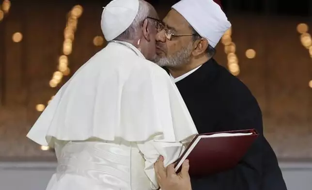 FILE - Pope Francis hugs Sheikh Ahmed el-Tayeb, the grand imam of Egypt's Al-Azhar, after an Interreligious meeting at the Founder's Memorial in Abu Dhabi, United Arab Emirates, Monday, Feb. 4, 2019. (AP Photo/Andrew Medichini, file)