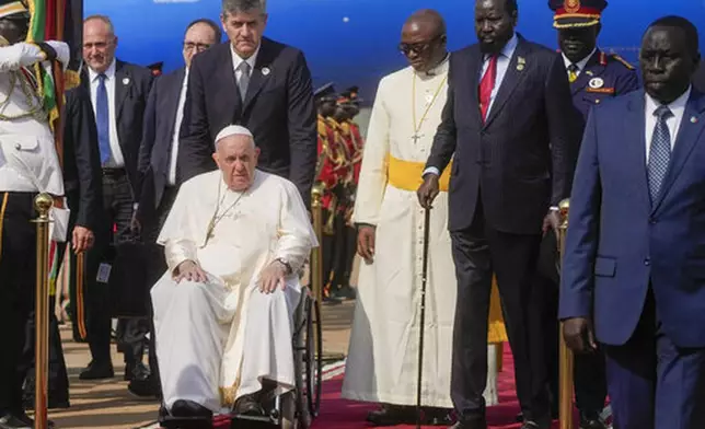FILE - Pope Francis is welcomed by South Sudan's President Salva Kiir, second from right, upon his arrival at Juba's airport, South Sudan, Friday, Feb. 3, 2023. (AP Photo/Gregorio Borgia, File)