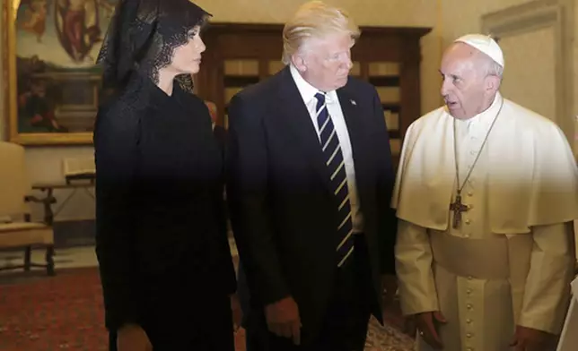FILE - Pope Francis meets with US President Donald Trump and First lady Melania Trump on the occasion of their private audience, at the Vatican, Wednesday, May 24, 2017. (AP Photo/Alessandra Tarantino, Pool, file)
