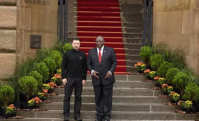 South Africa's President Cyril Ramaphosa greets Ukrainian President Volodymyr Zelenskyy, at the Union Buildings in Pretoria, South Africa, Thursday, April 24, 2025. (AP Photo/Themba Hadebe)