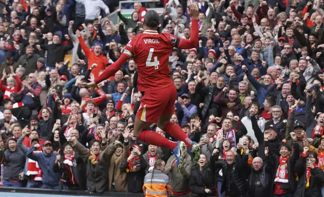 Liverpool's Virgil van Dijk celebrates after scoring his side's second goal during the English Premier League soccer match between Liverpool and West Ham United at Anfield in Liverpool, Sunday, April 13, 2025. (AP Photo/Ian Hodgson)