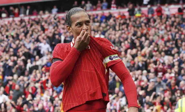 Liverpool's Virgil van Dijk celebrates after scoring his side's second goal during the English Premier League soccer match between Liverpool and West Ham United at Anfield in Liverpool, Sunday, April 13, 2025. (AP Photo/Ian Hodgson)