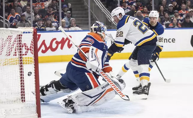 St. Louis Blues' Ryan Suter (22) scores on Edmonton Oilers goalie Calvin Pickard (30) during first period NHL action in Edmonton on Wednesday, April 9, 2025. (Jason Franson/The Canadian Press via AP)