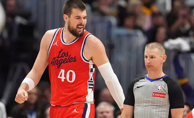 Los Angeles Clippers center Ivica Zubac, left, argues with referee Tyler Ford after calling a foul on Zubac in the second half of Game 2 of a first-round NBA playoff series against the Denver Nuggets, Monday, April 21, 2025, in Denver. (AP Photo/David Zalubowski)