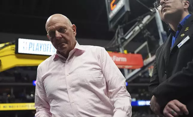 Steve Ballmer, owner of the Los Angeles Clippers, heads to a courtside seat to watch the second half of Game 2 of a first-round NBA playoff series against the Denver Nuggets, Monday, April 21, 2025, in Denver. (AP Photo/David Zalubowski)