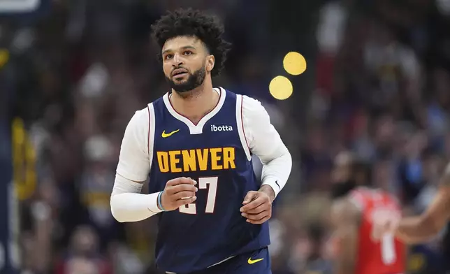 Denver Nuggets guard Jamal Murray drops back to defend after hitting a basket against the Los Angeles Clippers in the second half of Game 2 of a first-round NBA playoff series Monday, April 21, 2025, in Denver. (AP Photo/David Zalubowski)
