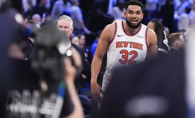 New York Knicks center Karl-Anthony Towns (32) reacts following Game 1 in an NBA basketball first-round playoff series against the Detroit Pistons, Saturday, April 19, 2025, in New York. (AP Photo/Julia Demaree Nikhinson)