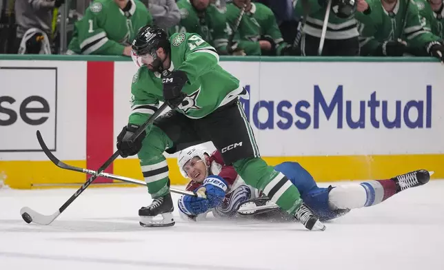 Dallas Stars center Colin Blackwell (15) skates away from the puck after taking it from Colorado Avalanche center Martin Necas during the first period in Game 2 of a first-round NHL hockey playoff series Monday, April 21, 2025, in Dallas. (AP Photo/Julio Cortez)
