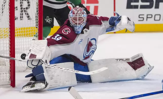 A shot by Dallas Stars center Tyler Seguin, not visible, gets by Colorado Avalanche goaltender Mackenzie Blackwood (39) for a power play goal during the first period in Game 2 of a first-round NHL hockey playoff series Monday, April 21, 2025, in Dallas. (AP Photo/Julio Cortez)