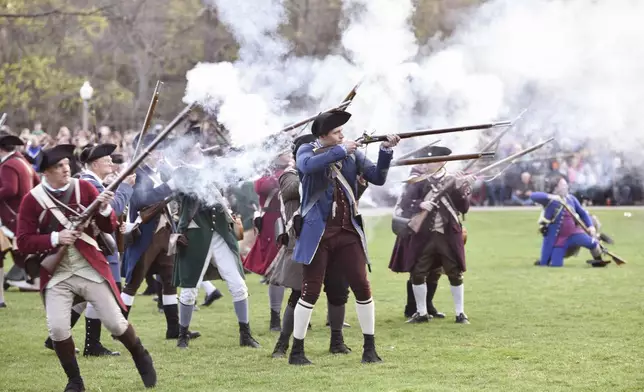 FILE - Colonial soldiers fire on the British during the Patriots' Day reenactment of the battles of Lexington and Concord, in Lexington, Mass. Monday, Aril 17, 2017. (Keith Viglione/The Boston Herald via AP,File)