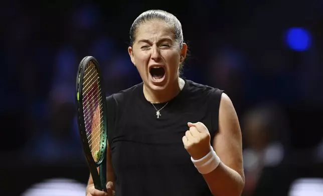 Jelena Ostapenko of Latvia celebrates after the women's singles semi-final tennis match of the WTA tour against Ekaterina Alexandrova of Russia, in Stuttgart, Germany, Sunday, April 20, 2025. (Marijan Murat/dpa via AP)