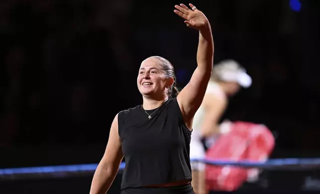 Jelena Ostapenko of Latvia celebrates after the women's singles semi-final tennis match of the WTA tour against Ekaterina Alexandrova of Russia, in Stuttgart, Germany, Sunday, April 20, 2025. (Marijan Murat/dpa via AP)