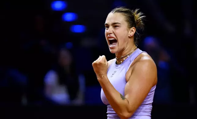 Aryna Sabalenka of Belarus celebrates after the women's singles semi-final tennis match of the WTA tour against Jasmine Paolini of Italy, in Stuttgart, Germany, Sunday, April 20, 2025. (Marijan Murat/dpa via AP)