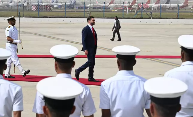 U.S. Vice President JD Vance, center, arrives in New Delhi, India Monday, April 21, 2025. (Kenny Holston/The New York Times via AP, Pool)