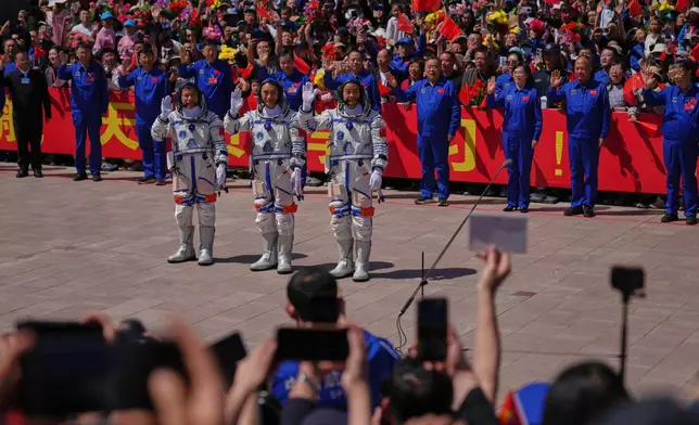 Chinese astronauts for the Shenzhou 20 mission, from right, Chen Zhongrui, Chen Dong and Wang Jie wave as they attend a send-off ceremony for their manned space mission at the Jiuquan Satellite Launch Center in northwestern China, Thursday, April 24, 2025. (AP Photo/Andy Wong)