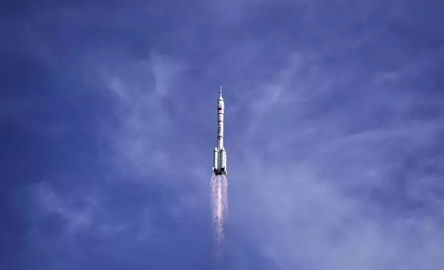 China's Long March 2F rocket, carrying three astronauts for the Shenzhou 20 manned space mission, lifts off for a space station, at the Jiuquan Satellite Launch Center in Jiuquan, northwestern China, Thursday, April 24, 2025. (AP Photo/Andy Wong)