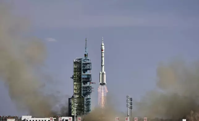 China's Long March 2F rocket, carrying three astronauts for the Shenzhou 20 manned space mission, lifts off for a space station, at the Jiuquan Satellite Launch Center in Jiuquan, northwestern China, Thursday, April 24, 2025. (AP Photo/Andy Wong)