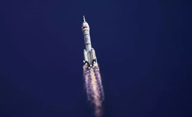 China's Long March 2F rocket, carrying three astronauts for the Shenzhou 20 manned space mission, heads for a space station, at the Jiuquan Satellite Launch Center in Jiuquan, northwestern China, Thursday, April 24, 2025. (AP Photo/Andy Wong)