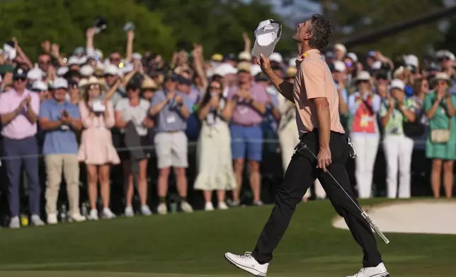 Justin Rose celebrates after a birdie on the 18th hole during the final round at the Masters golf tournament, Sunday, April 13, 2025, in Augusta, Ga. (AP Photo/Matt Slocum)