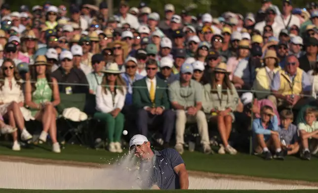 Rory McIlroy, of Northern Ireland, hits from the bunker on the 18th hole during the final round at the Masters golf tournament, Sunday, April 13, 2025, in Augusta, Ga. (AP Photo/Matt Slocum)