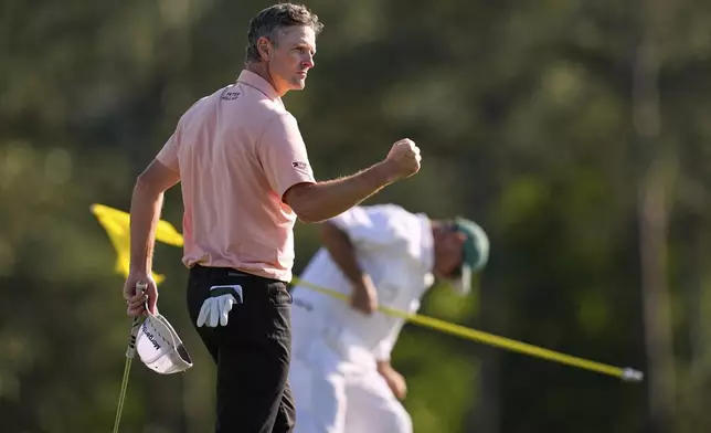 Justin Rose celebrates after a birdie on the 18th hole during the final round at the Masters golf tournament, Sunday, April 13, 2025, in Augusta, Ga. (AP Photo/David J. Phillip)