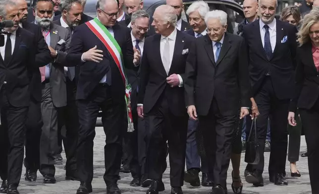 King Charles III, center, listens to Rome's Mayor Roberto Gualtieri, left, as he arrives with Italian President Sergio Mattarella, right, for a conference on climate inside the Rome's Mattatoio exhibition center, Wednesday, April 9, 2025. (AP Photo/Alessandra Tarantino)
