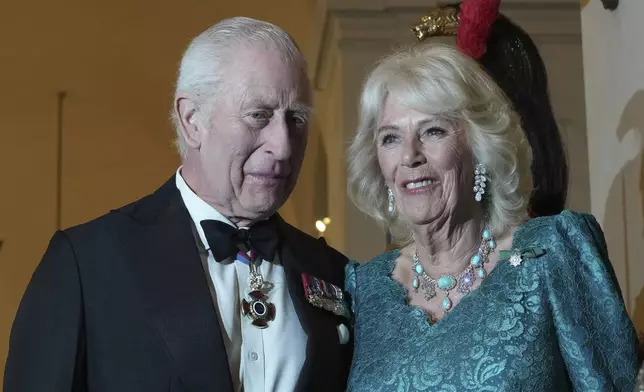 Britain's King Charles III and Queen Camilla arrive for an official dinner with Italy's President Sergio Mattarella at the Quirinale Presidential Palace in Rome, Wednesday, April 9, 2025. (AP Photo/Andrew Medichini)