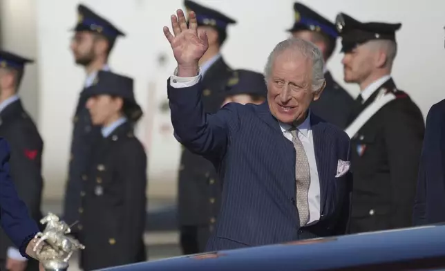 King Charles III waives upon arrival at Rome's International Airport G.B. Pastine in Ciampino for a four-day official visit to Italy, Monday, April 7, 2025. (AP Photo/Andrew Medichini)