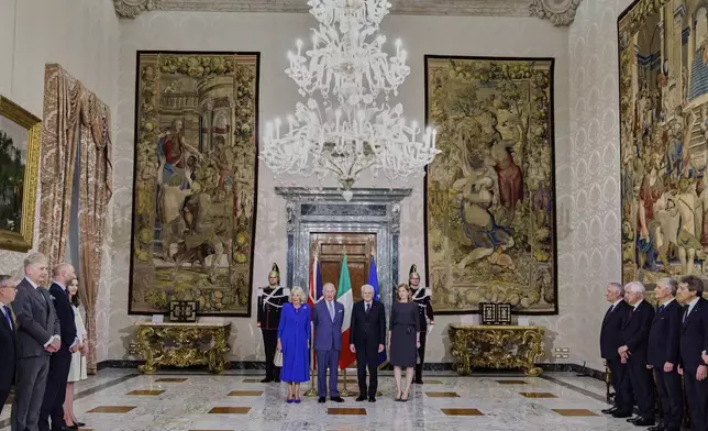 Italian President Sergio Mattarella, center right, and his daughter Laura, right, pose for a family photo with Britain's King Charles III, center left, and Queen Camilla, left, on the occasion of their meeting at the Quirinale Presidential Palace, in Rome, Tuesday, April 8, 2025 (Roberto Monaldo/LaPresse via AP)