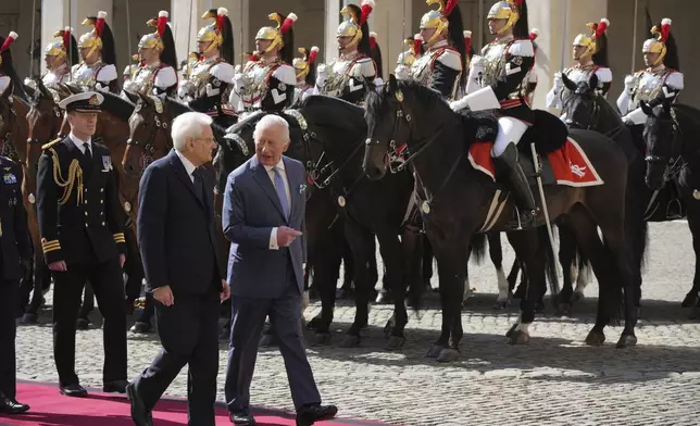 King Charles III, right, arrive at the Quirinale Presidential Palace to meet Italy's President Sergio Mattarella, in Rome, Tuesday, April 8, 2025. (AP Photo/Alessandra Tarantino)