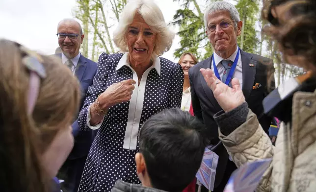 Queen Camilla meets with primary school children of the Alessandro Manzoni Institute in Rome, Wednesday, April 9, 2025. (AP Photo/Gregorio Borgia)