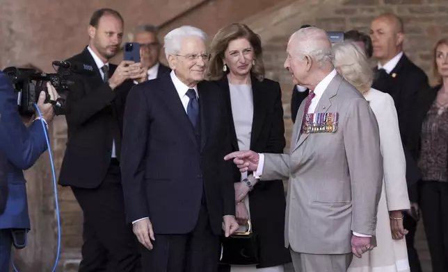 Britain's King Charles III and Queen Camilla meet Italy's President Sergio Mattarella, left, in Ravenna, Italy, Thursday, April 10, 2025. (Massimo Paolone/LaPresse via AP)