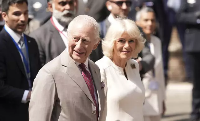 Britain's King Charles III and Queen Camilla meet well wishers as they arrive at the Piazza San Francesco, in Ravenna, Italy, Thursday, April 10, 2025. (Massimo Paolone/LaPresse via AP)