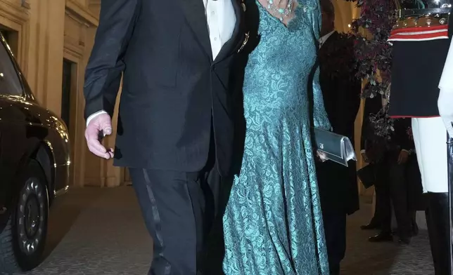 Britain's King Charles III and Queen Camilla arrive for an official dinner with Italy's President Sergio Mattarella at the Quirinale Presidential Palace in Rome, Wednesday, April 9, 2025. (AP Photo/Andrew Medichini)