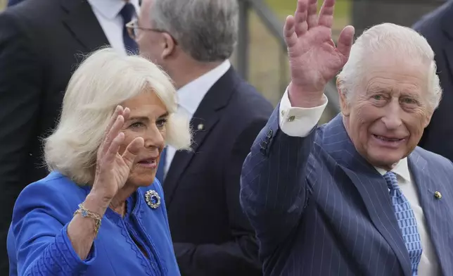 King Charles III, right, and Queen Camilla walk through the Colosseum archeological park, in Rome, Tuesday, April 8, 2025. (AP Photo/Andrew Medichini)