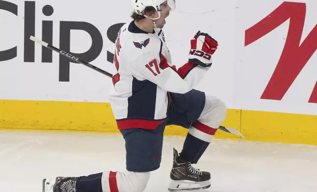 Washington Capitals' Dylan Strome (17) celebrates his goal over the Montreal Canadiens during the second period of an NHL playoff game in Montreal, Sunday, April 27, 2025. (Christinne Muschi/The Canadian Press via AP)