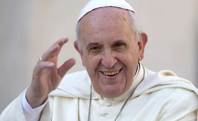FILE - Pope Francis delivers his blessing as he arrives to hold his weekly general audience, in St. Peter's Square, at the Vatican, Wednesday, Sept. 17, 2014. (AP Photo/Andrew Medichini, File)