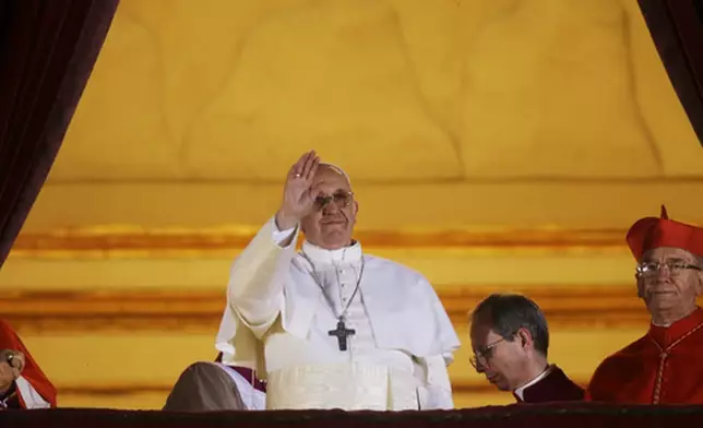 FILE - Pope Francis on the central balcony of St. Peter's Basilica at the Vatican, Wednesday, March 13, 2013. Cardinal Jorge Bergoglio, who chose the name of Francis is the 266th pontiff of the Roman Catholic Church. (AP Photo/Gregorio Borgia, File)
