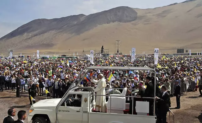 FILE - Pope Francis arrives to celebrate Mass on Lobito Beach in Iquique, Chile, on Jan. 18, 2018. (AP Photo/Alessandra Tarantino, File)