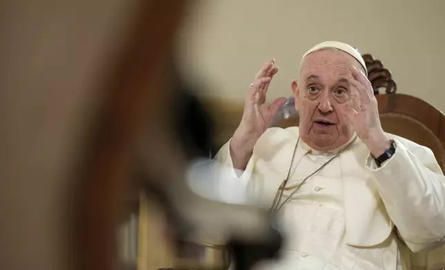 FILE - Pope Francis speaks during an interview with The Associated Press at The Vatican, Tuesday, Jan. 24, 2023. (AP Photo/Andrew Medichini, File )