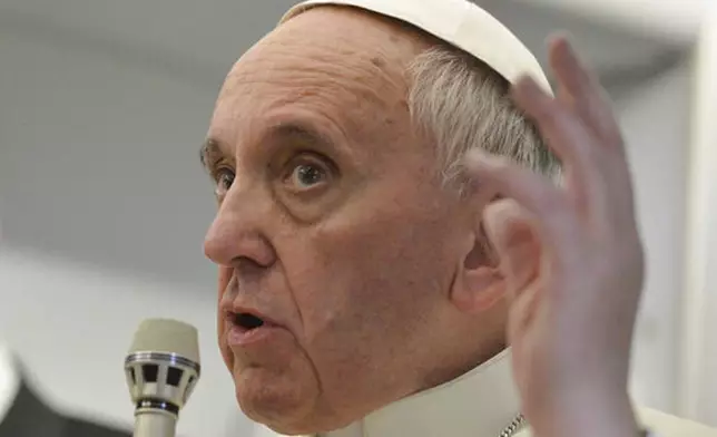 FILE - Pope Francis talks about gays saying he wouldn't judge priests for their sexual orientation in a remarkably open and wide-ranging news conference aboard the papal flight on the journey back from Brazil, Monday, July 29, 2013. (AP Photo/Luca Zennaro, Pool, file)