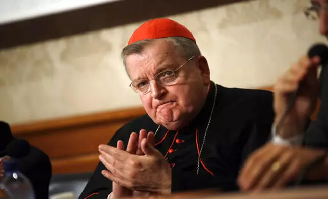 FILE - Cardinal Raymond Burke applauds during a news conference on the first anniversary of the death of Cardinal Carlo Caffarra, at the Italian Senate, in Rome, Thursday, Sept. 6, 2018. (AP Photo/Alessandra Tarantino, file)