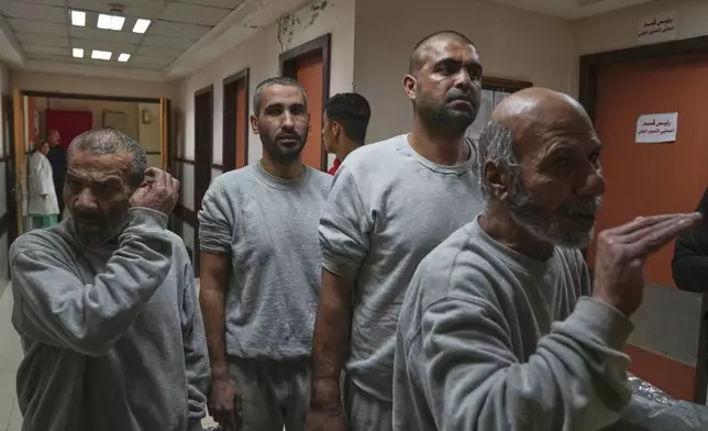 Freed Palestinian prisoners upon arrival at al-Aqsa Hospital in Deir al-Balah, central Gaza Strip, after being released from an Israeli prison, Thursday, April 10, 2025. (AP Photo/Abdel Kareem Hana)
