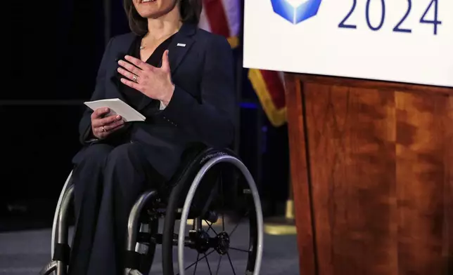 FILE - Cheri Blauwet, co-chair of the Boston 2024 Olympic and Paralympic Movement Committee, addresses reporters during a news conference by organizers of Boston's campaign for the 2024 Summer Olympics in Boston, Jan. 21, 2015. (AP Photo/Charles Krupa, File)